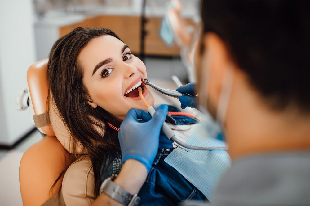 Young Female Patient Visiting Dentist Office.jpg